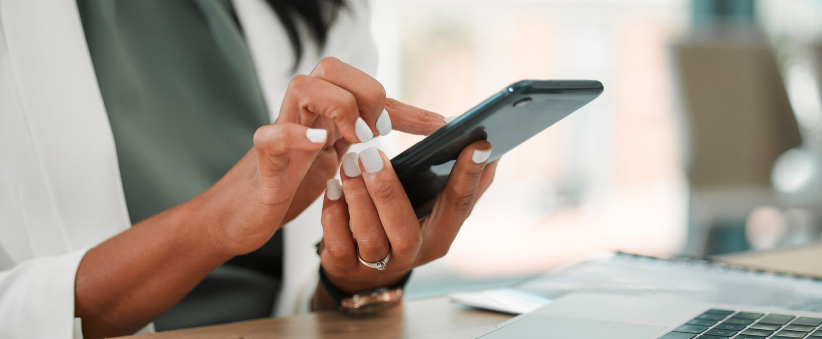 close-up of hands using a smartphone